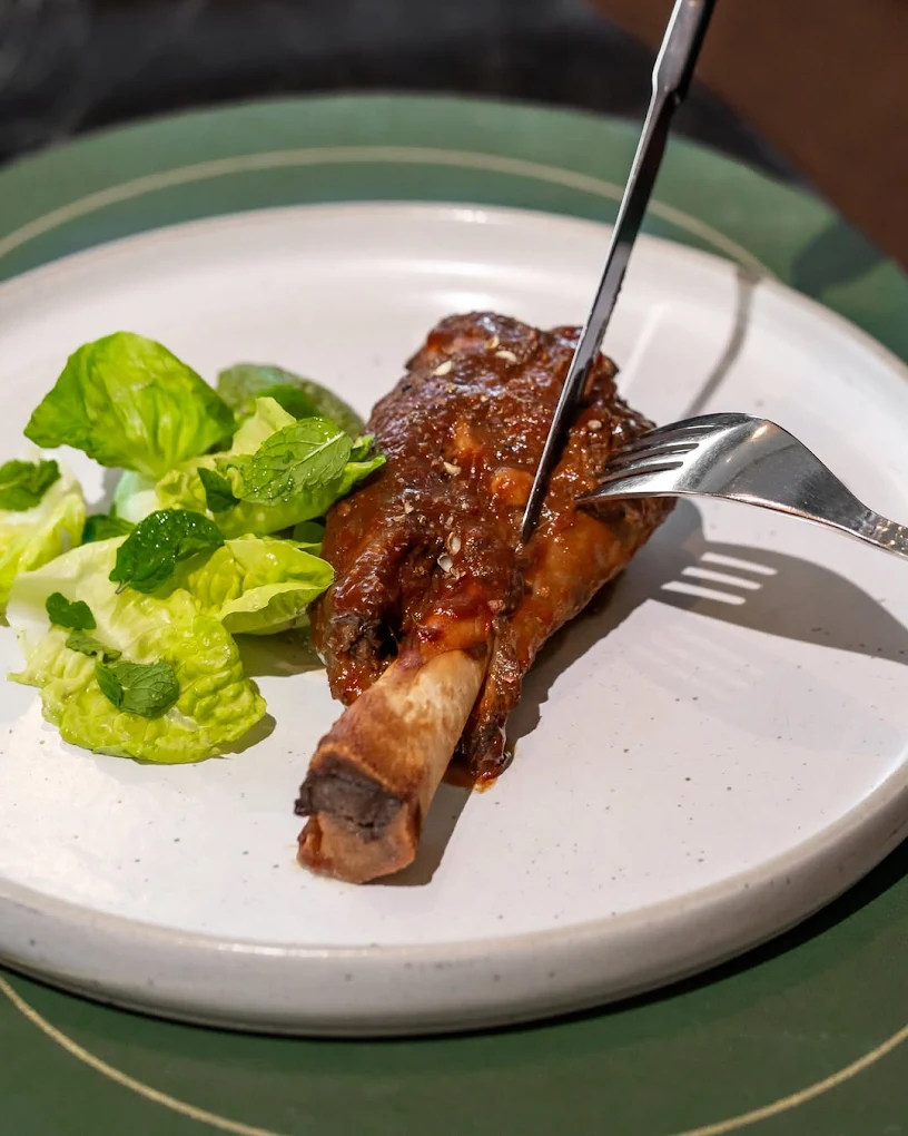 Ribs on a plate with salad garnish