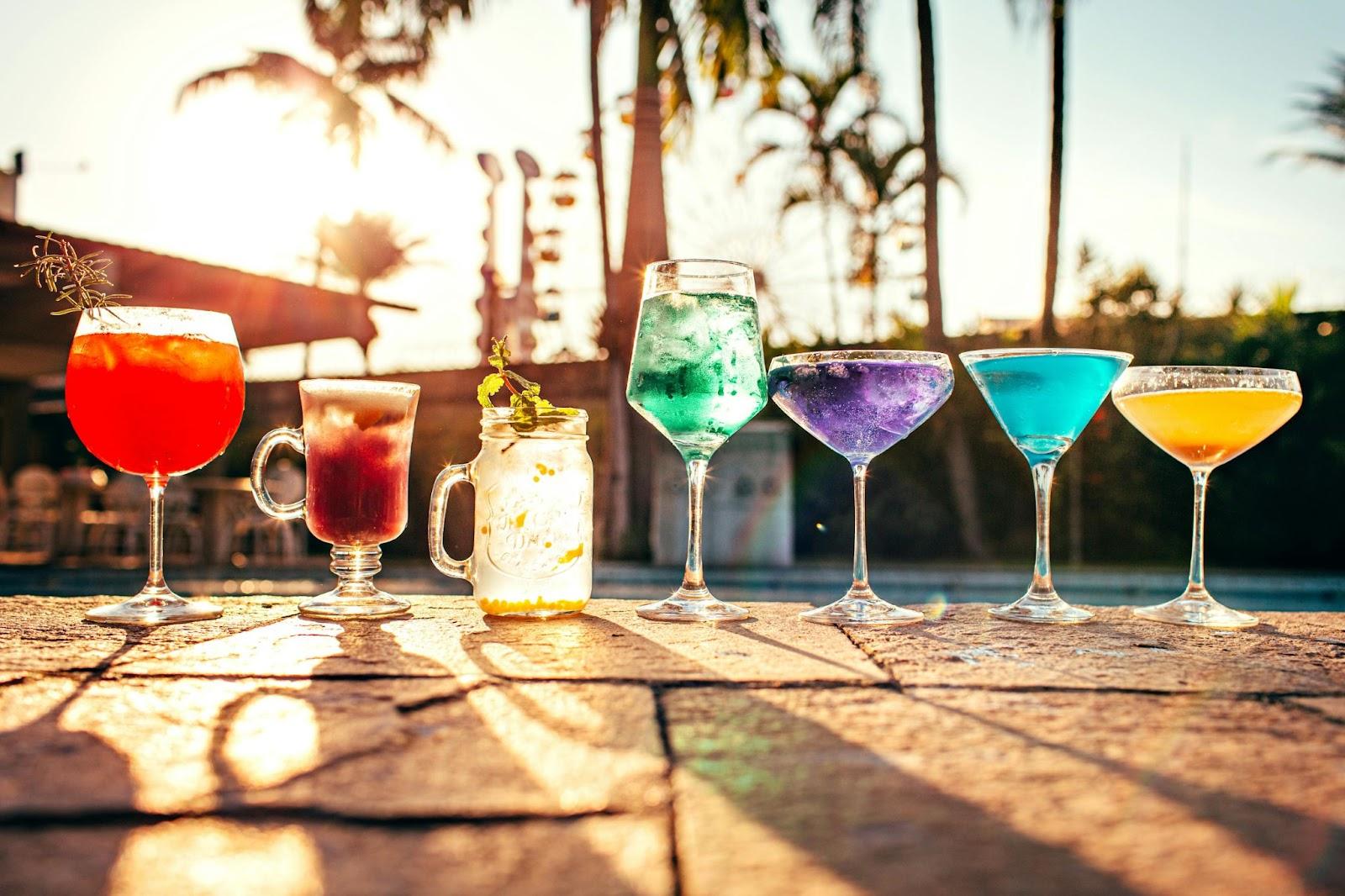 Colourful cocktails standing in a line