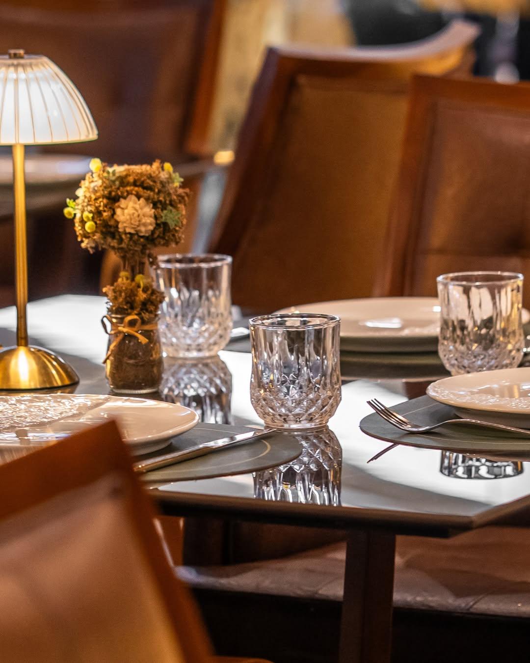 A set table of dinnerware at a chophouse