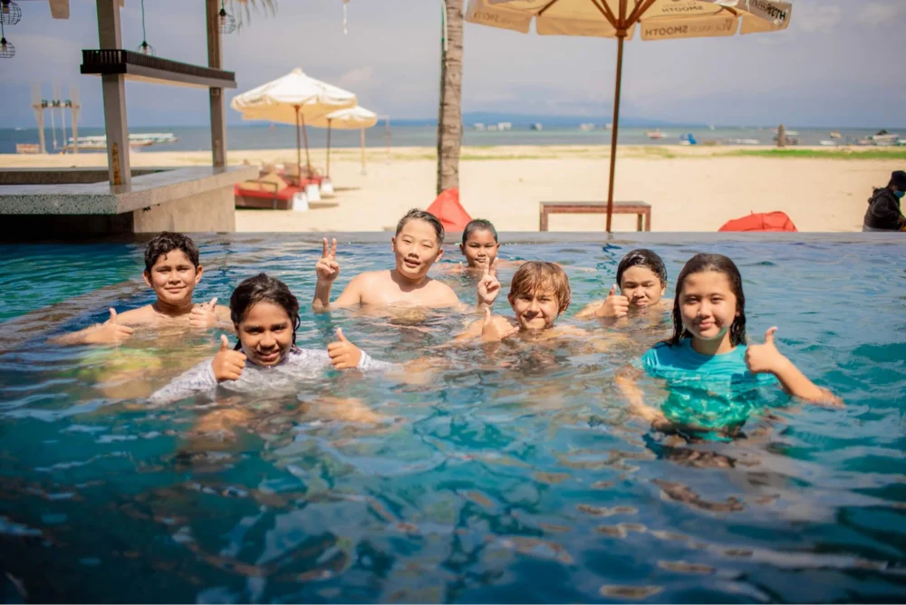 Children on holiday in Bali enjoying a pool