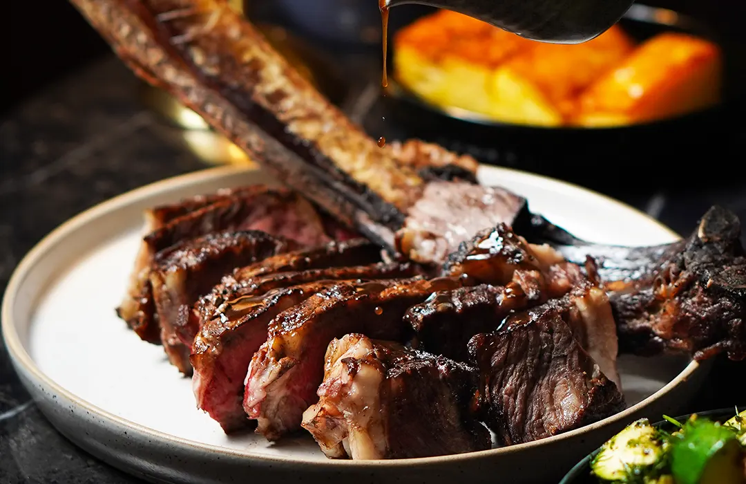 A sliced tomahawk steak