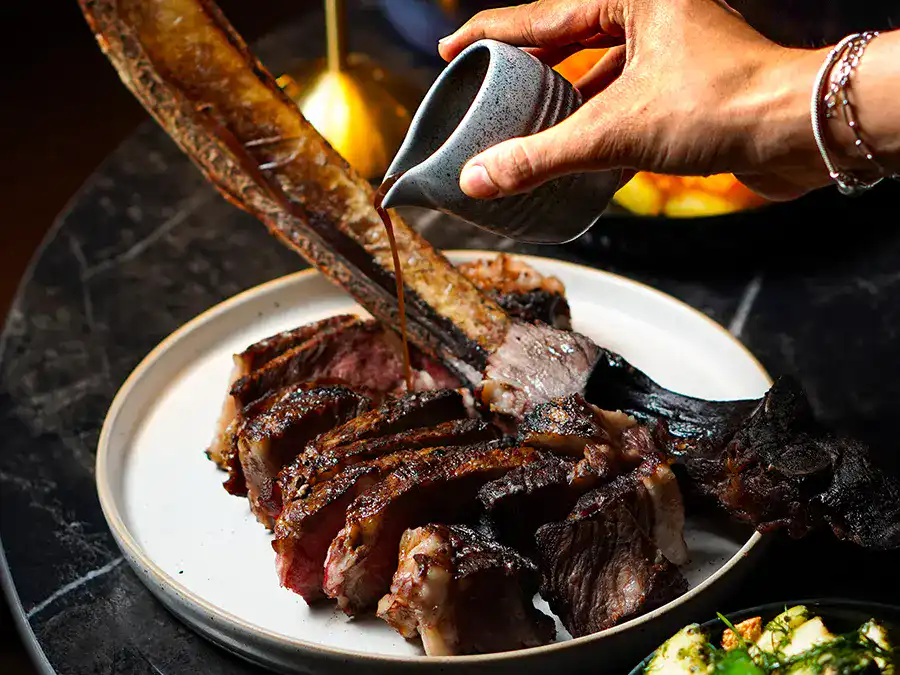 A sliced tomahawk steak
